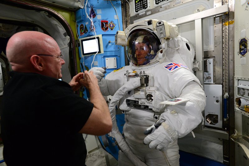 Scott Kelly and Tim Peake final checks on EVA suit